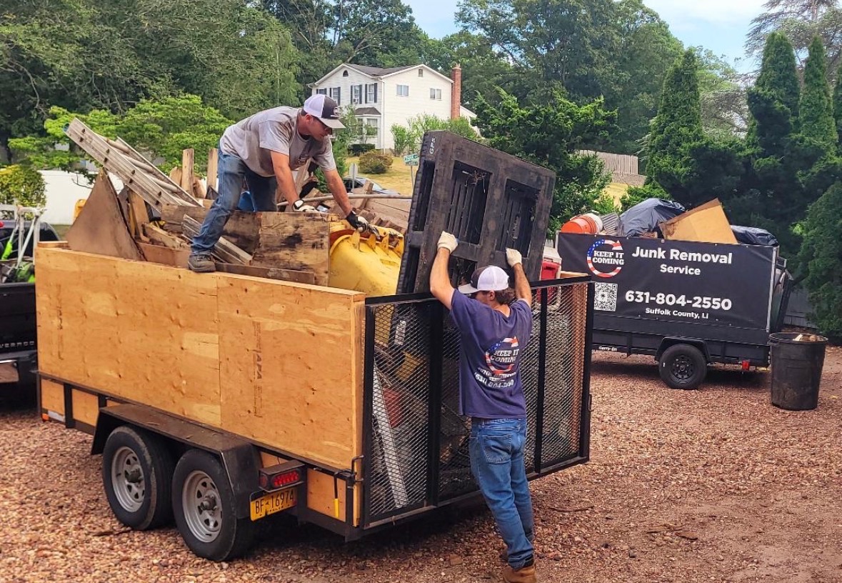 Keep It Coming crew loading a junk trailer in Suffolk County
