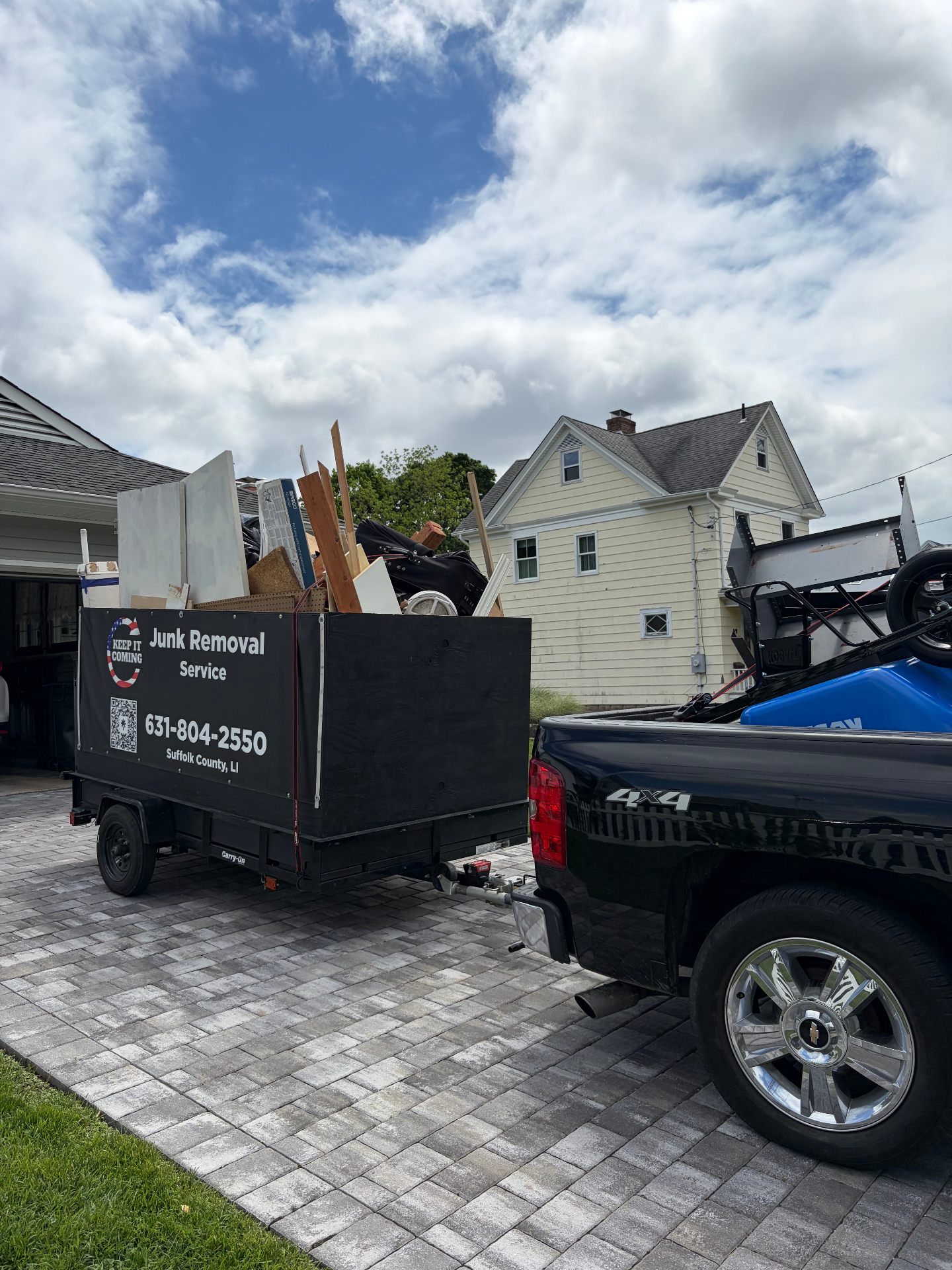 Loaded Keep It Coming trailer in a driveway