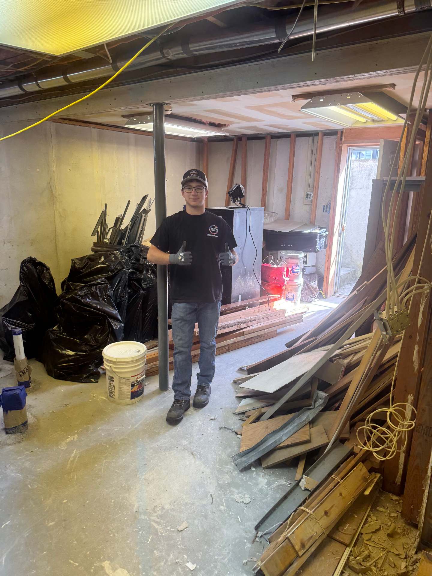 Cluttered basement before cleanout